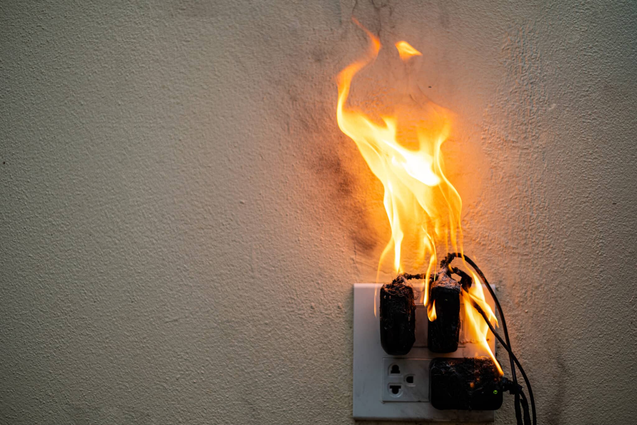 Electric outlets on fire due to not being protected by a whole home surge protector