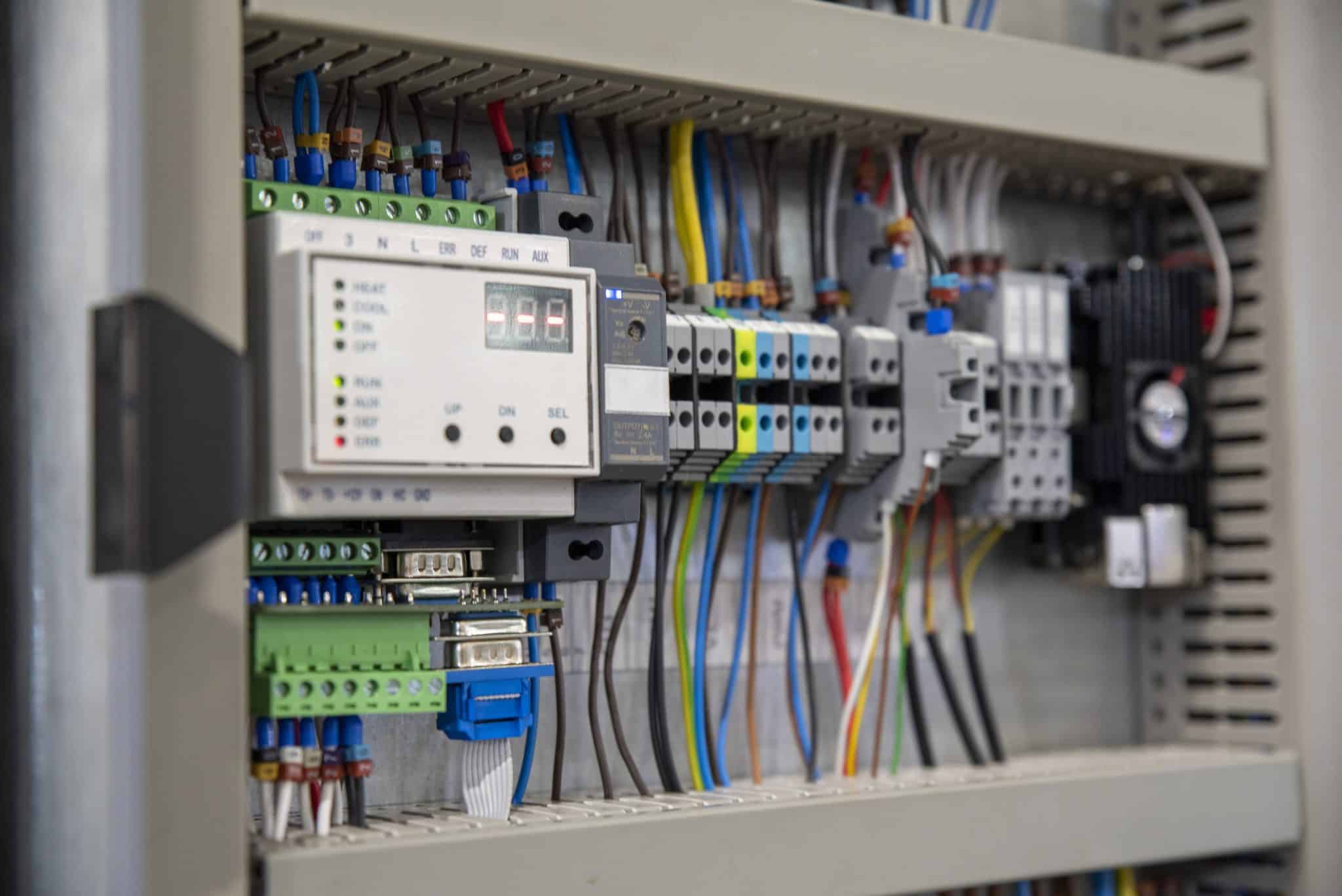Image of an open main panel with smart electrical components.